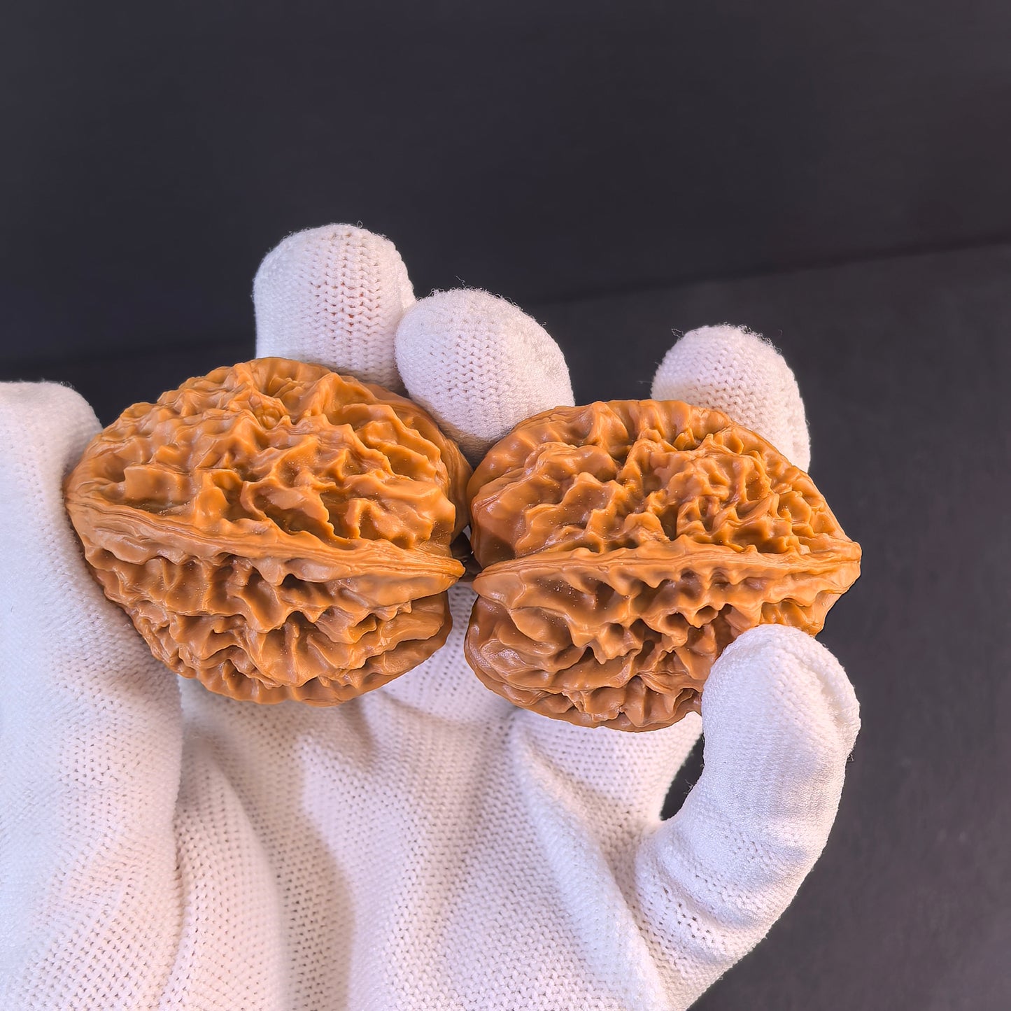 Walnut hand exercisers featuring "Fortune Mouse" design, 40mm prosperity pair by ThePatinaProject, ideal for hand strengthening and stress relief.