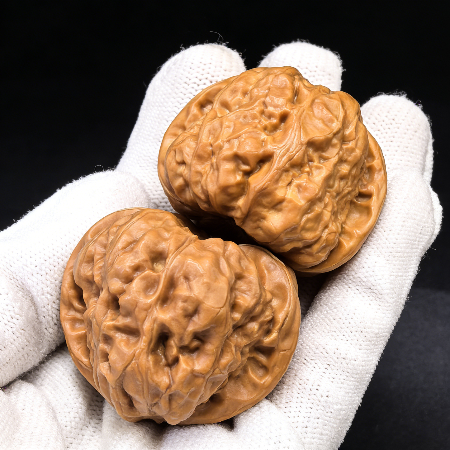 Walnut hand exercisers featuring the Golden Money Toad design, shown as a pair of 40mm rare pictographic Walnut hand grips.