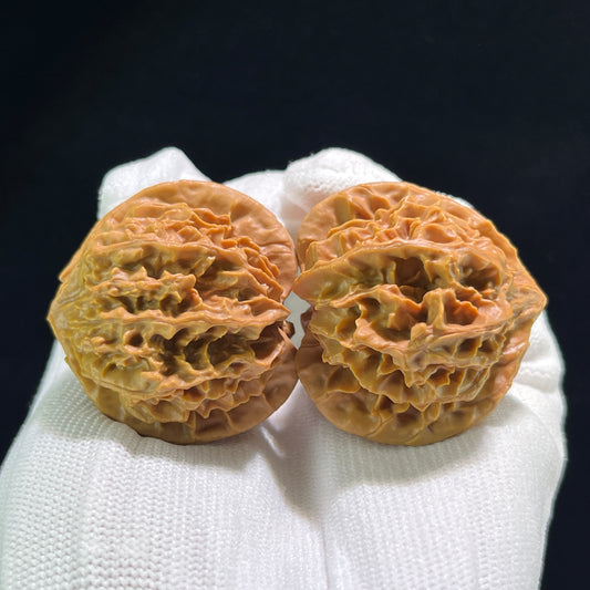 Pair of Walnut Hand Exercisers called Lantern (Deng Long) by ThePatinaProject, measuring 39mm x 38mm, shown in the image.