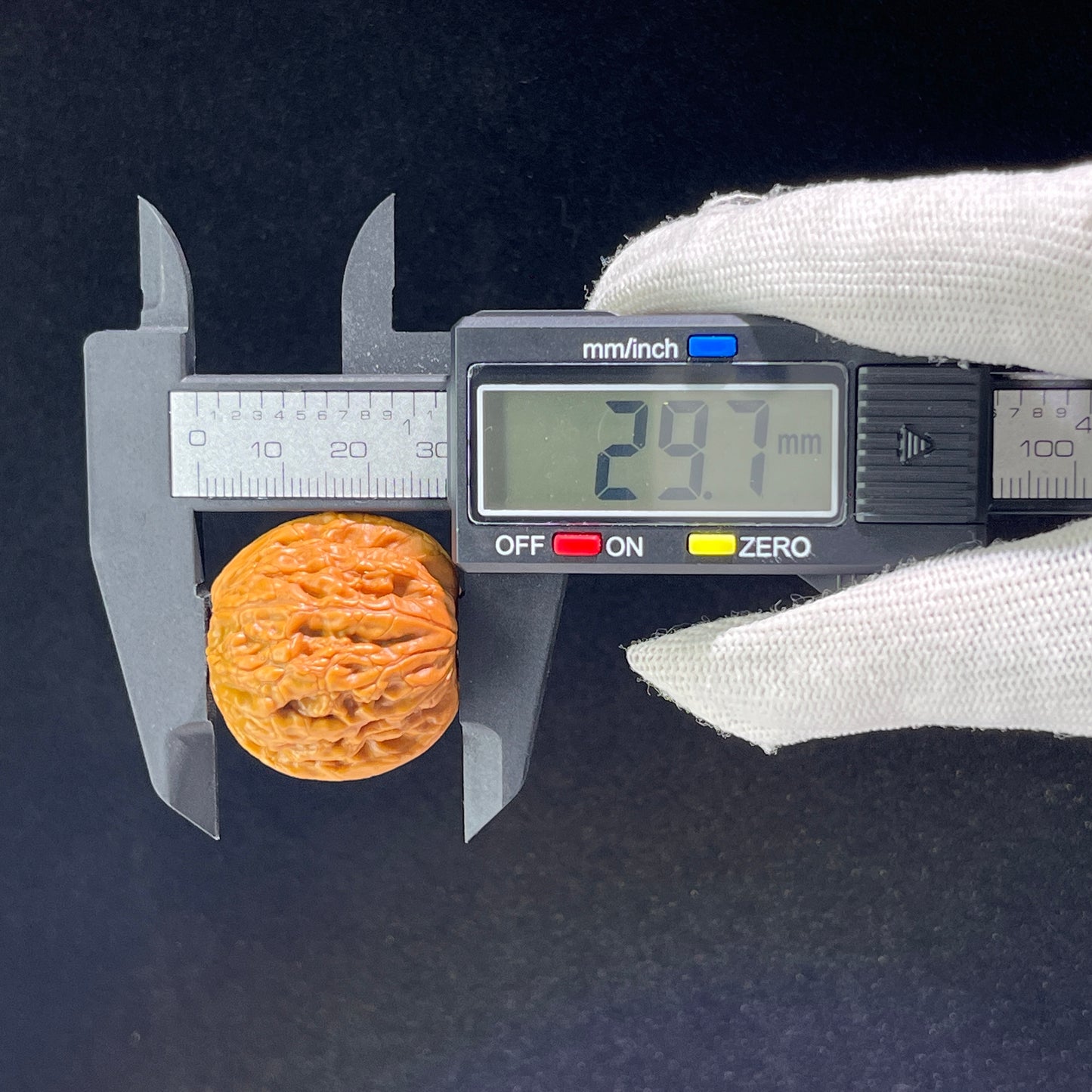 Walnut hand exerciser shaped like a meteorite ingot, 31mm by 34mm, from ThePatinaProject's Yun Shi Yuan Bao collection.