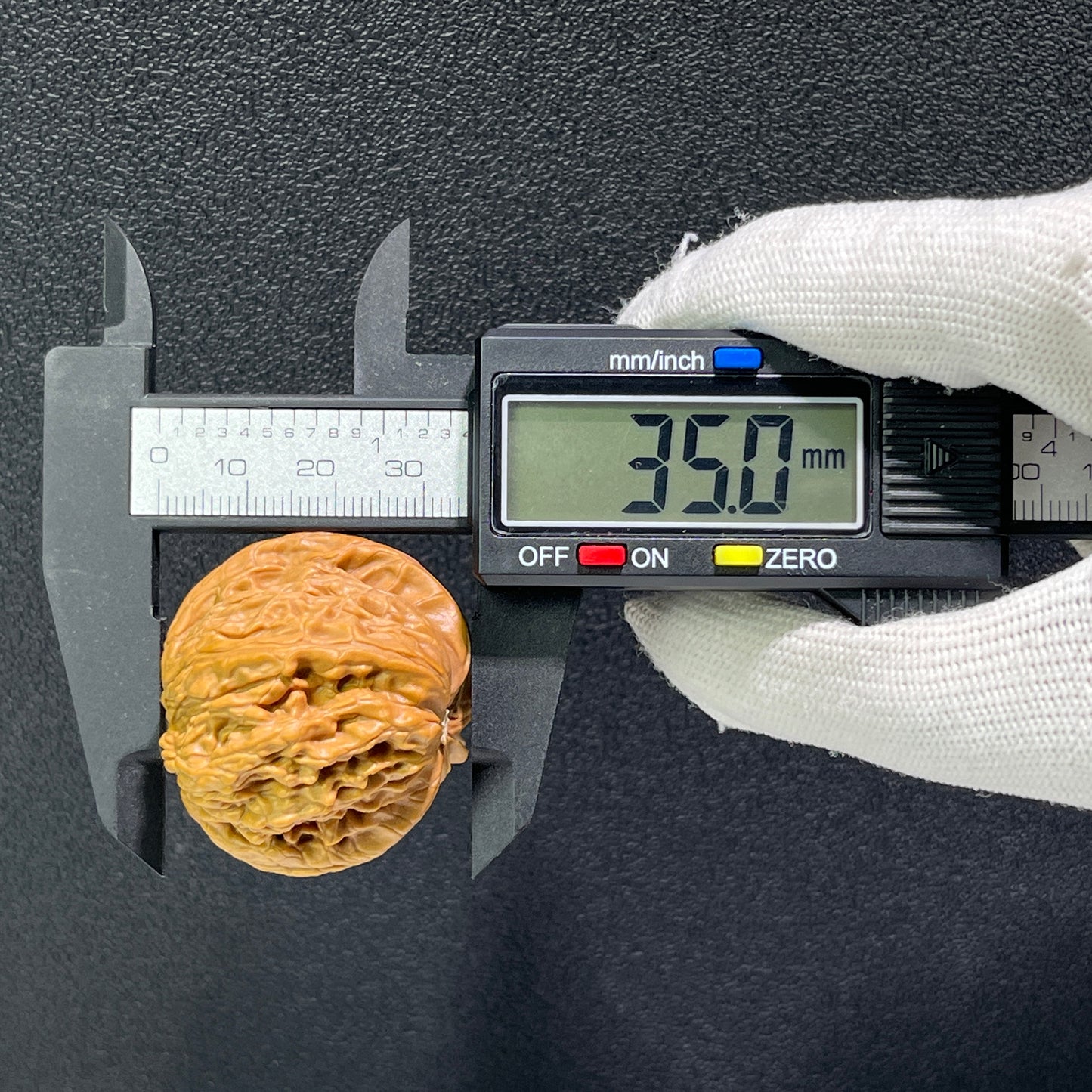 Walnut hand exerciser from ThePatinaProject's Millstone Natural Mutation Base Pair, 39mm x 40mm, used for grip strength training.