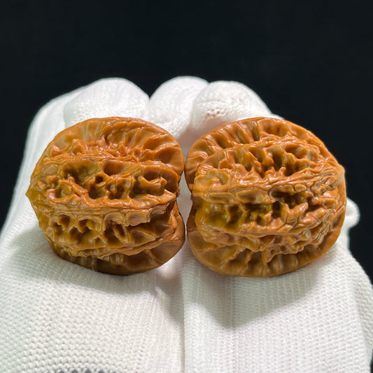 Pair of Nuwa Stone Walnut Hand Exercisers by ThePatinaProject, 36mm x 33mm, showing smooth, rounded wooden grips for hand strength training.