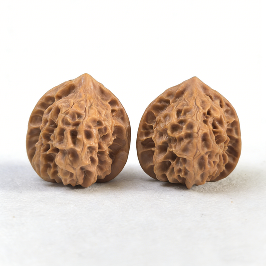 Walnut hand exerciser from ThePatinaProject, Petite Ling Long Exquisite Pair, 31mm, LN-01, showing textured walnut surface and compact design.