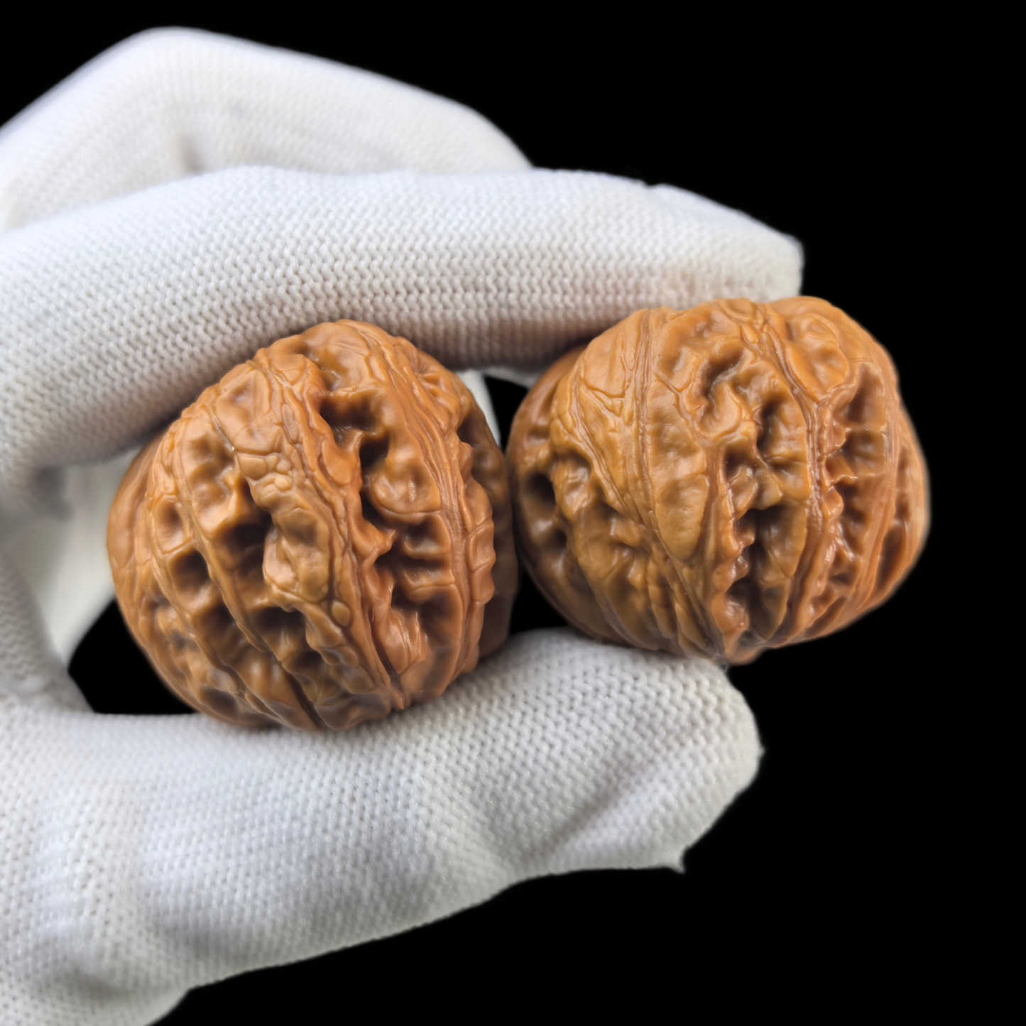Pair of Walnut Hand Exercisers shaped like gold ingots, 38mm, from ThePatinaProject, with detailed walnut grain and smooth finish.