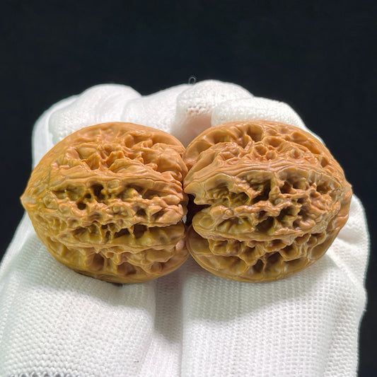 ThePatinaProject Wild Ox Walnut Hand Exerciser pair with 36mm diameter, balanced 1:1 ratio, featuring smooth wooden handles.