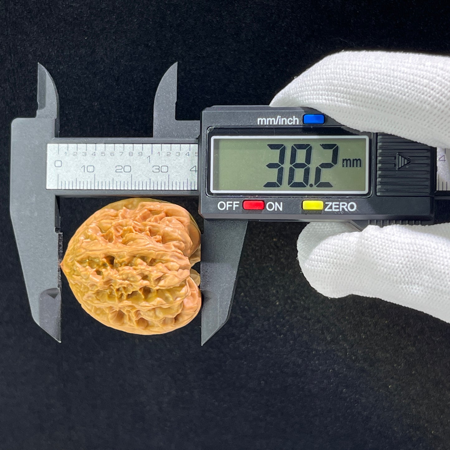 Walnut hand exerciser pair ThePatinaProject Wild Ox Ye Niu Balanced 1:1, 36mm x 36mm, showing textured surface and natural wood finish.