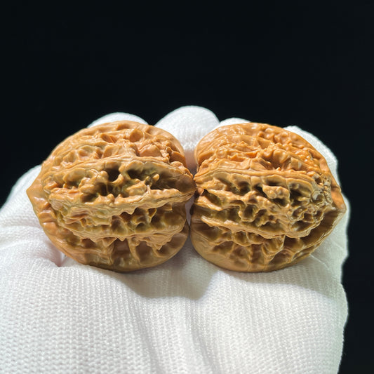 Pair of Xia Yun Ling Peach Heart Walnut Hand Exercisers from ThePatinaProject, 40mm x 39mm, featuring carved peach heart design.