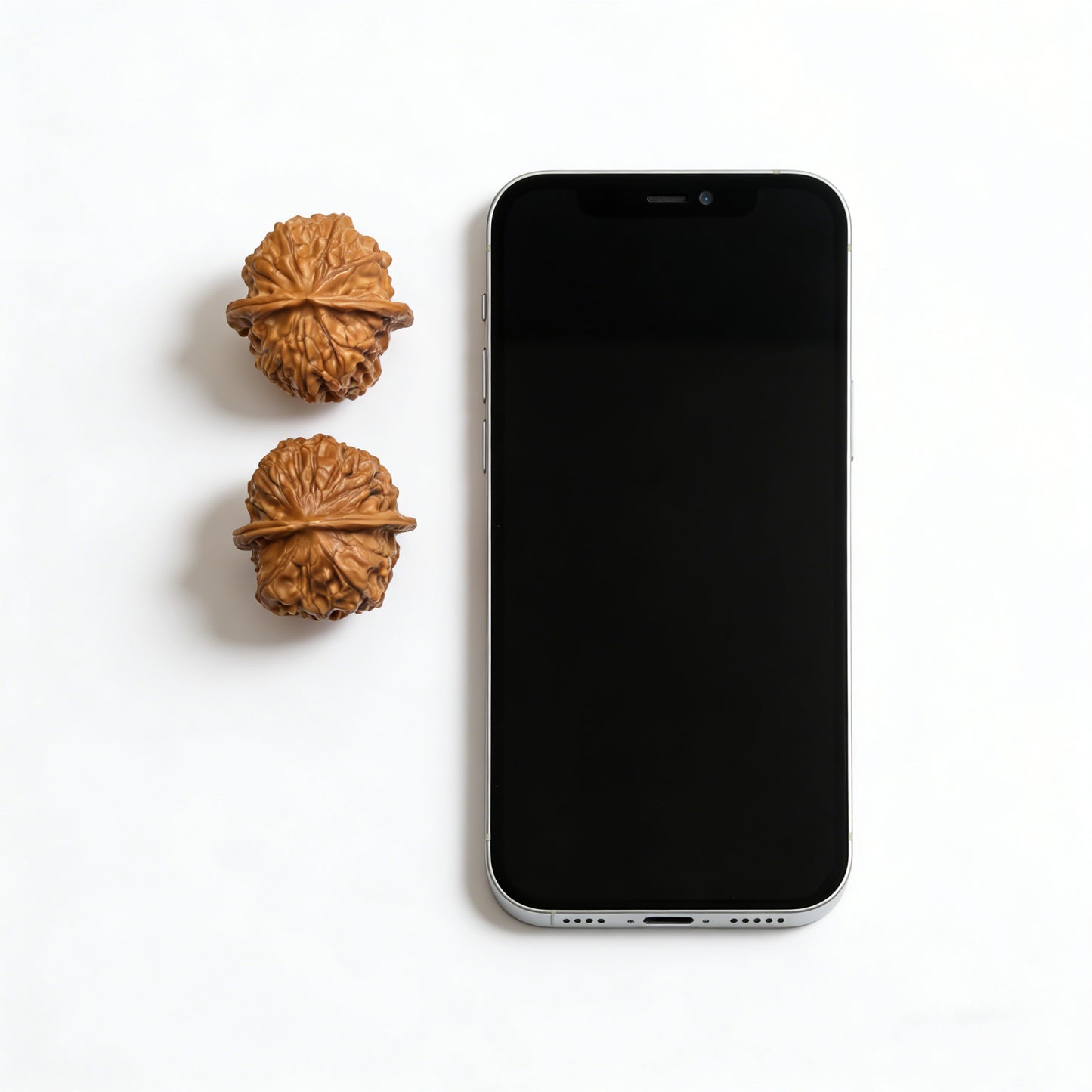 Pair of Xinglong Shaozi walnut hand exercisers, 35mm diameter, crafted by ThePatinaProject, showing polished wood texture and ergonomic shape.