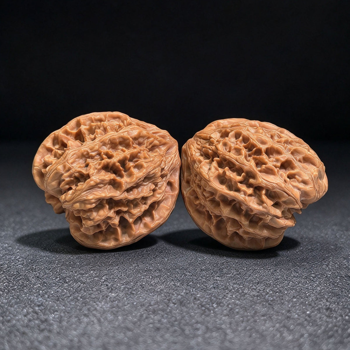 Red-Shell Wild Ox “Tian Can Jiao” Wenwan Walnuts Pair | Sculptural Natural Form | 41.0mm × 39.0mm | YN-C1E3E - ThePatinaProject