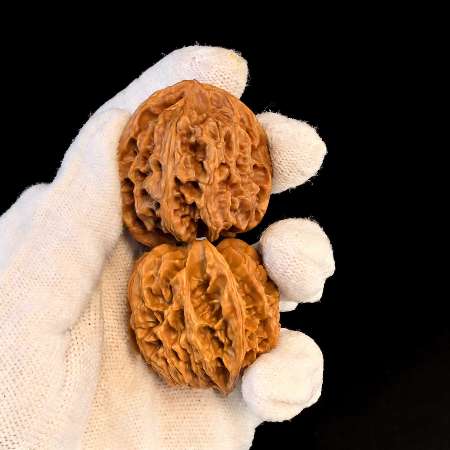 Walnut hand exercisers featuring lion head design, 38mm round pair by The Patina Project, part of the Apple Garden collection.