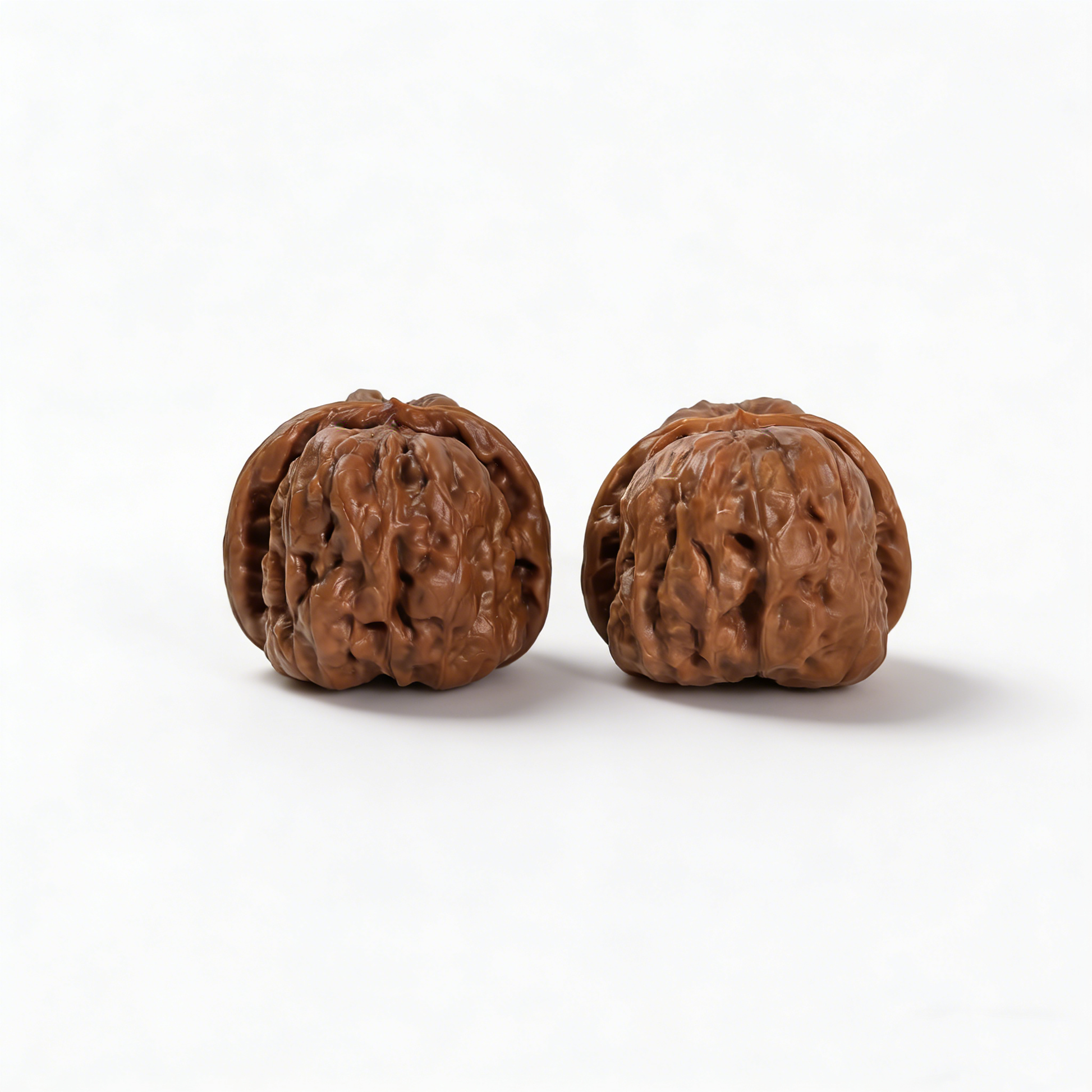 Walnut hand exerciser from The Patina Project's Toad Head collection, low-profile 36mm architecture, collector’s pair.