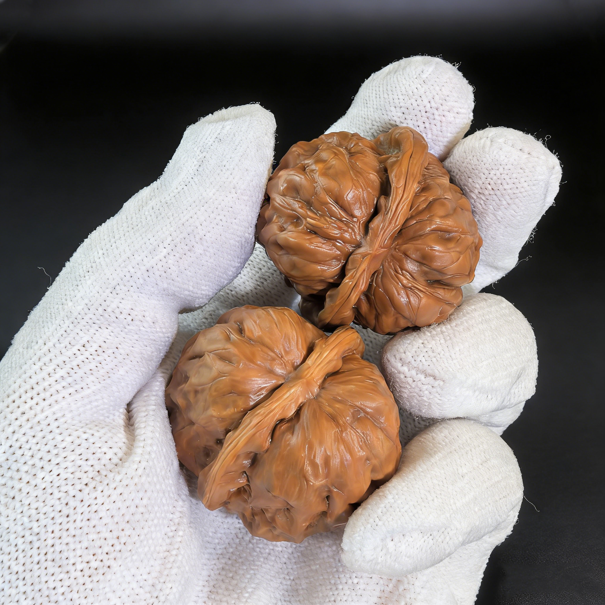 Walnut hand exercisers labeled "Toad Head" by The Patina Project, featuring a low-profile design for collector’s pair.