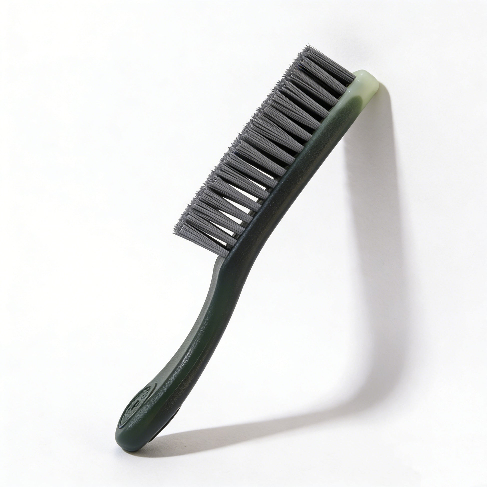 The PatinaProject Iron-Infused Nano Restoration Brush, care tool with iron-infused bristles for restoring and cleaning metal surfaces.