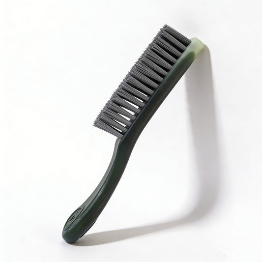 The PatinaProject Iron-Infused Nano Restoration Brush, care tool with iron-infused bristles for restoring and cleaning metal surfaces.