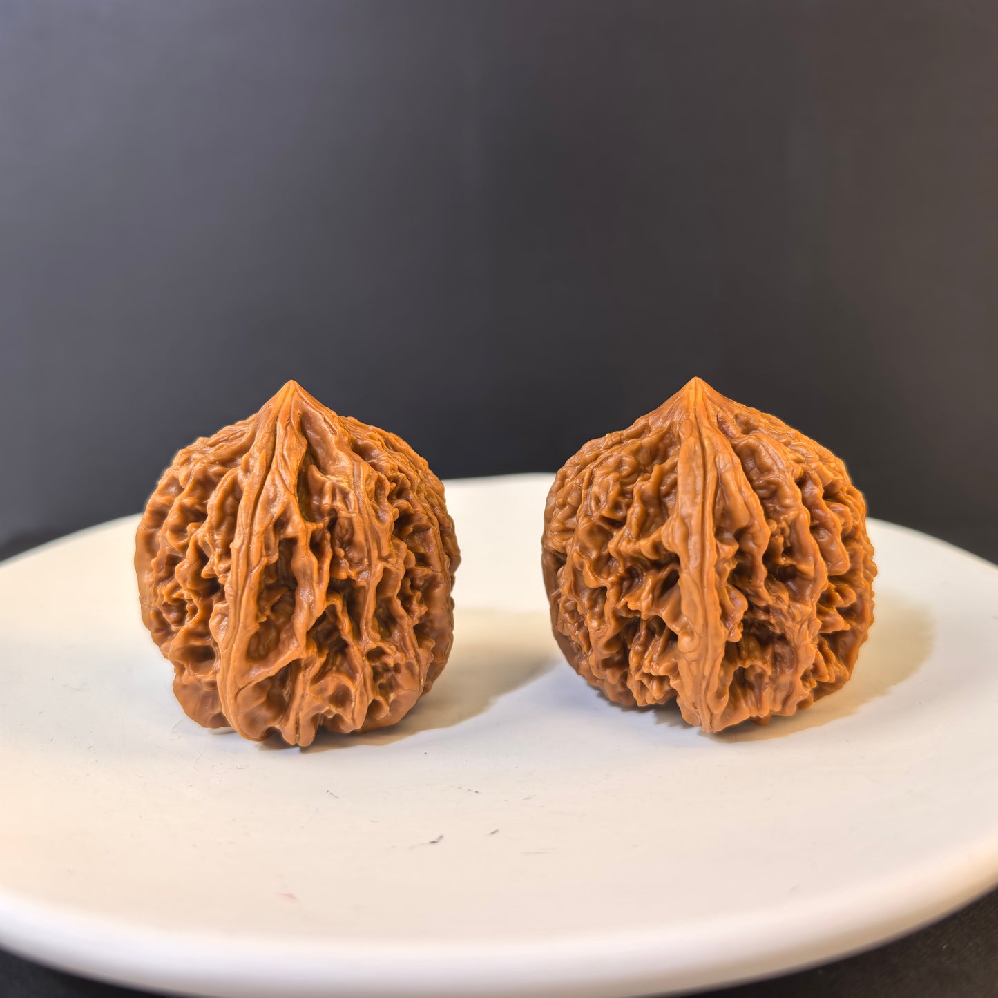 Walnut hand exercisers labeled Nine Dragon Muscle (Jiu Long Jin) with 39mm deep ridges, designed for grip strengthening and fitness.
