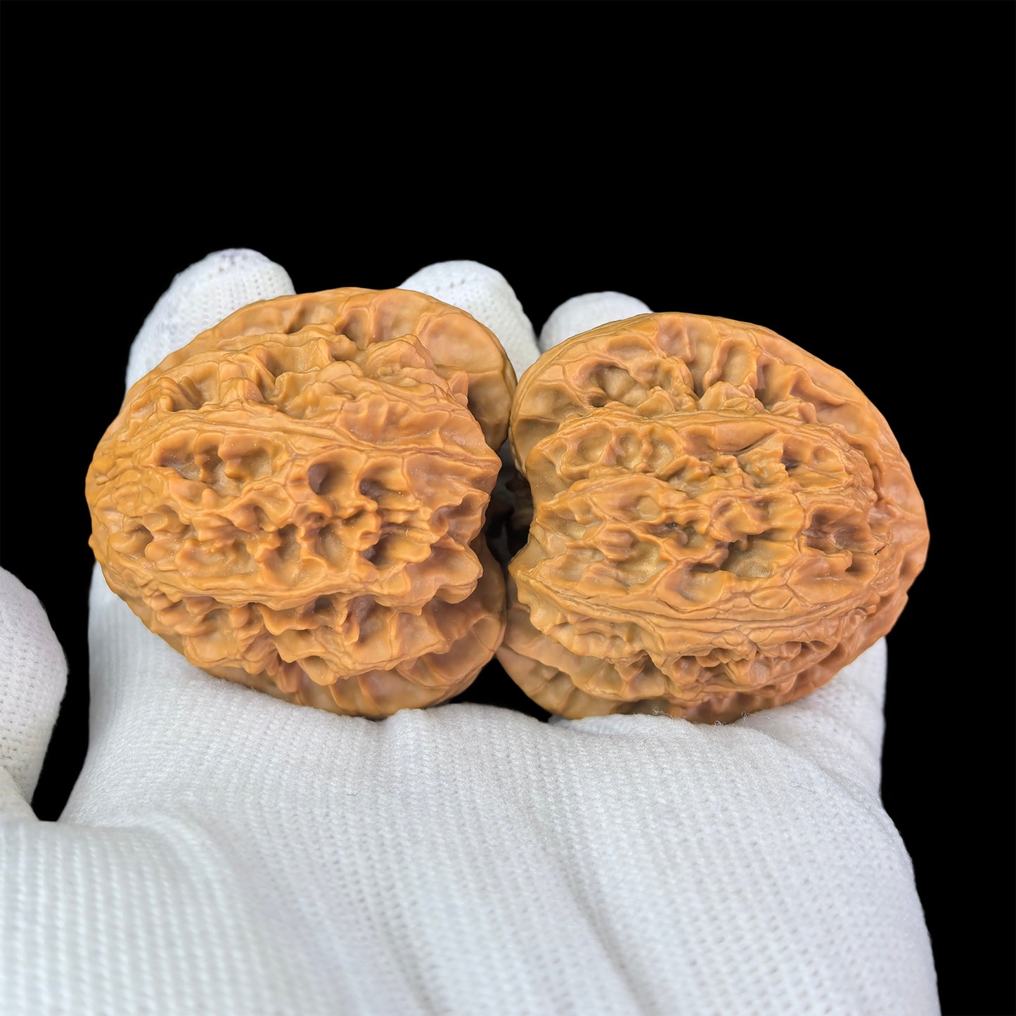 Pair of Walnut Hand Exercisers with lion head design, 43mm x 40mm, from ThePatinaProject, featuring detailed lion head motifs.
