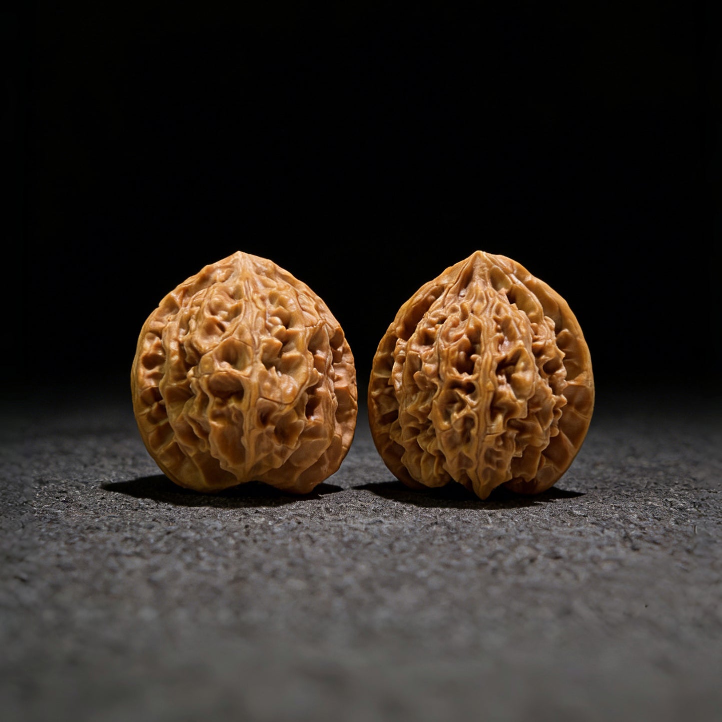Walnut hand exerciser pair labeled PGY-513 from ThePatinaProject, 34mm diameter, featuring smooth, polished walnut wood surfaces.