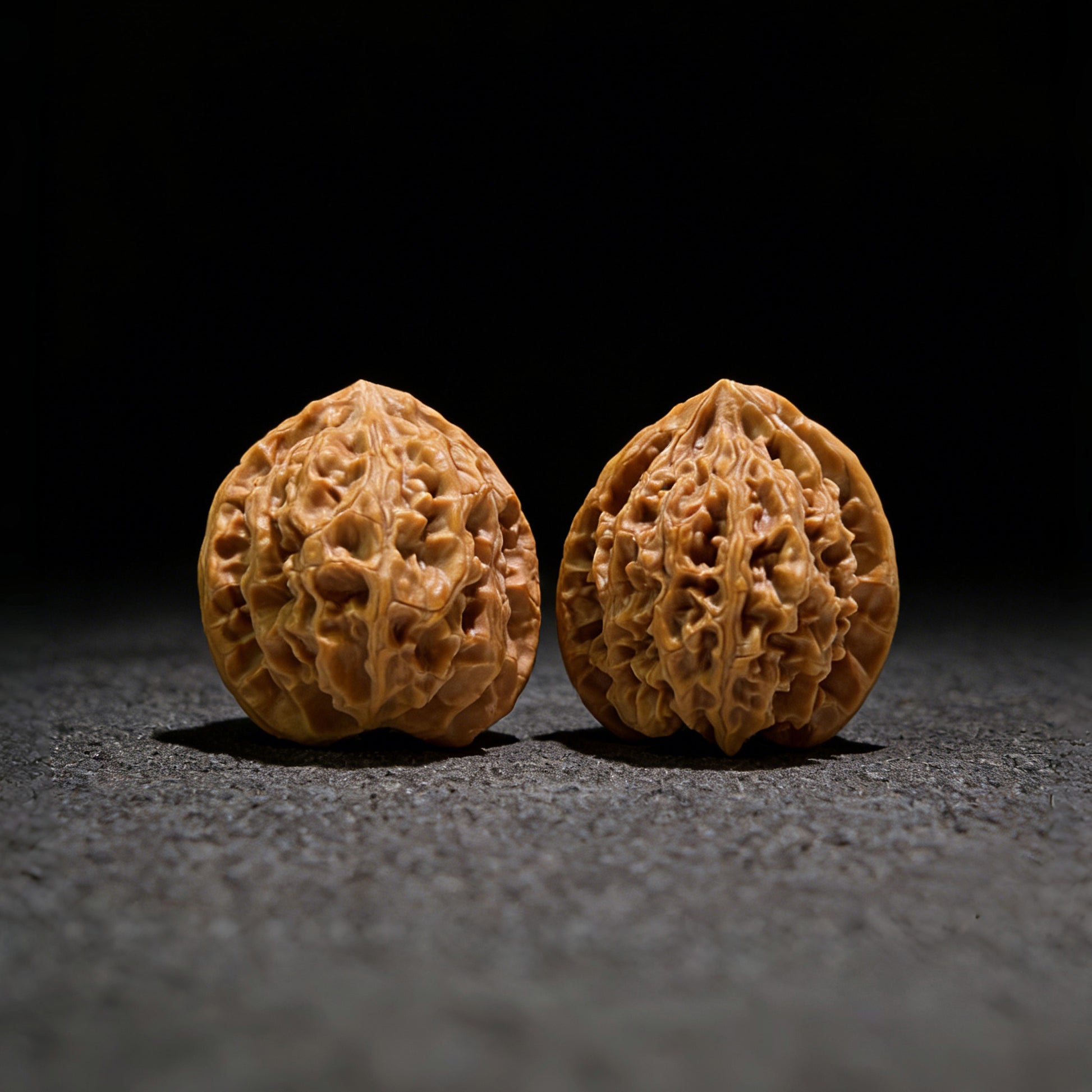 Walnut hand exerciser pair labeled PGY-513 from ThePatinaProject, 34mm diameter, featuring smooth, polished walnut wood surfaces.