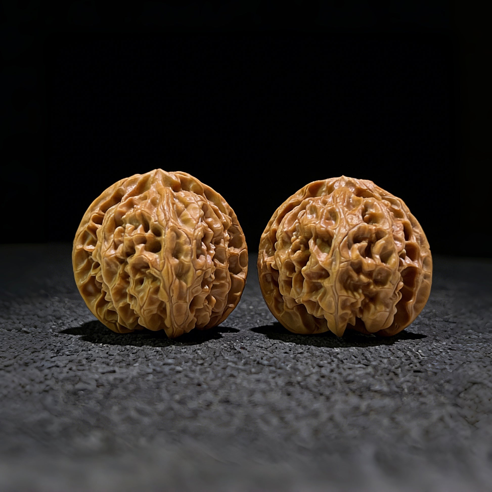 Pair of Walnut Hand Exercisers "Apple Round" by ThePatinaProject, 37mm x 36mm, with smooth polished wood finish.