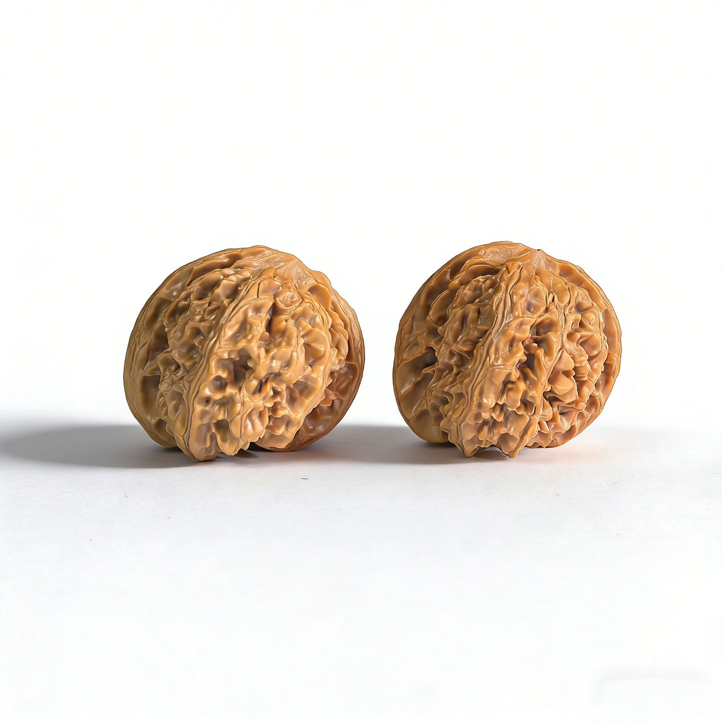Walnut hand exerciser "Apple Round" by ThePatinaProject, 43mm x 40mm, featuring smooth walnut wood surface and ergonomic shape.