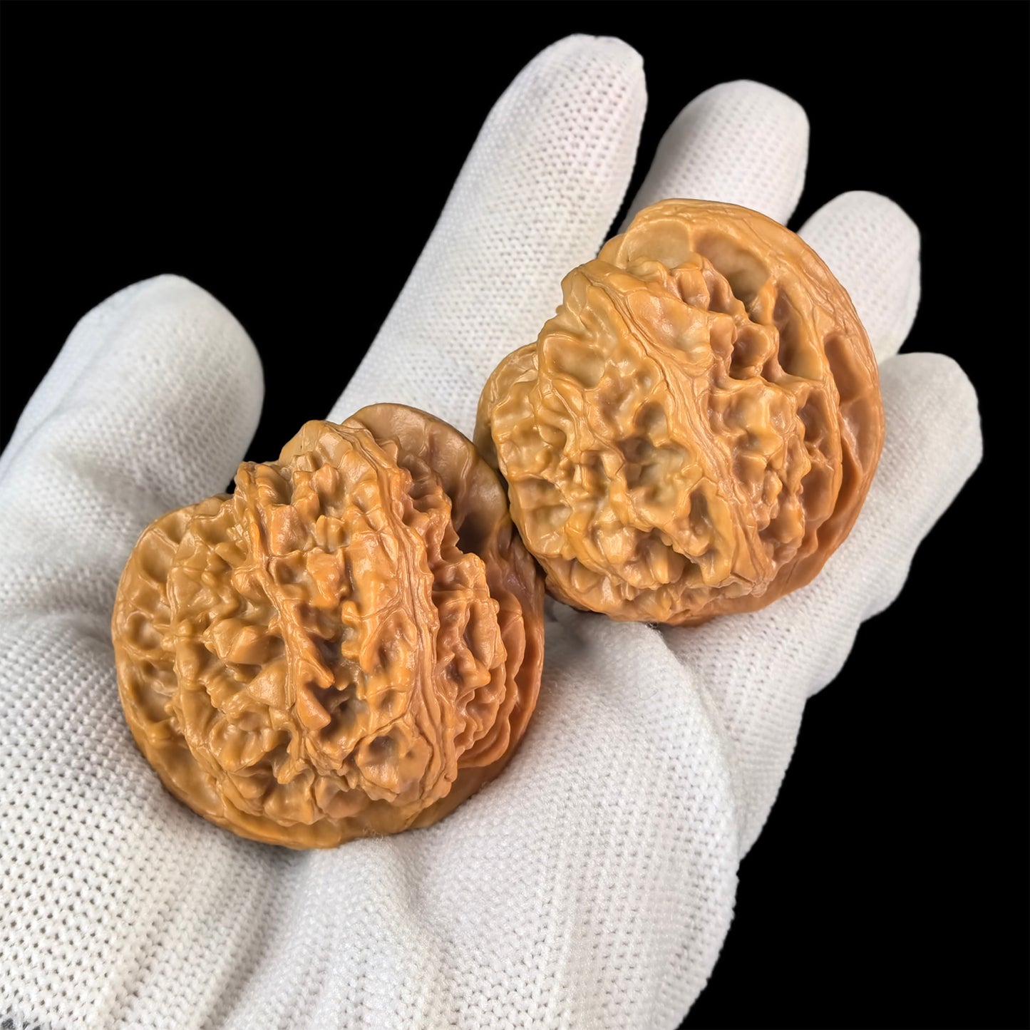 Walnut hand exerciser from ThePatinaProject, "Apple Round" PGY-03, 43mm x 40mm, with textured walnut surface for grip and exercise.