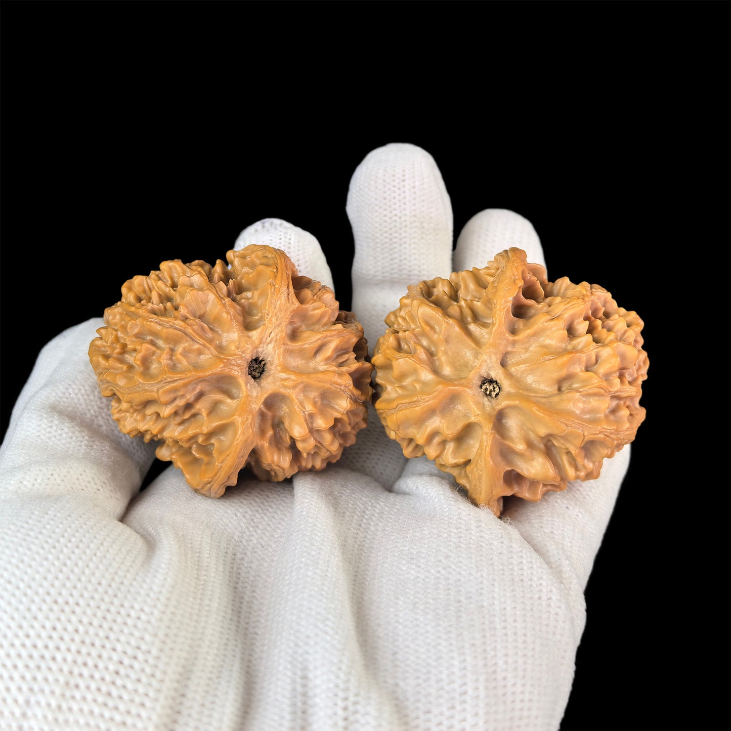 Walnut hand exerciser called "Apple Round" by ThePatinaProject, 43mm x 40mm, featuring a textured, smooth walnut surface for grip and exercise.