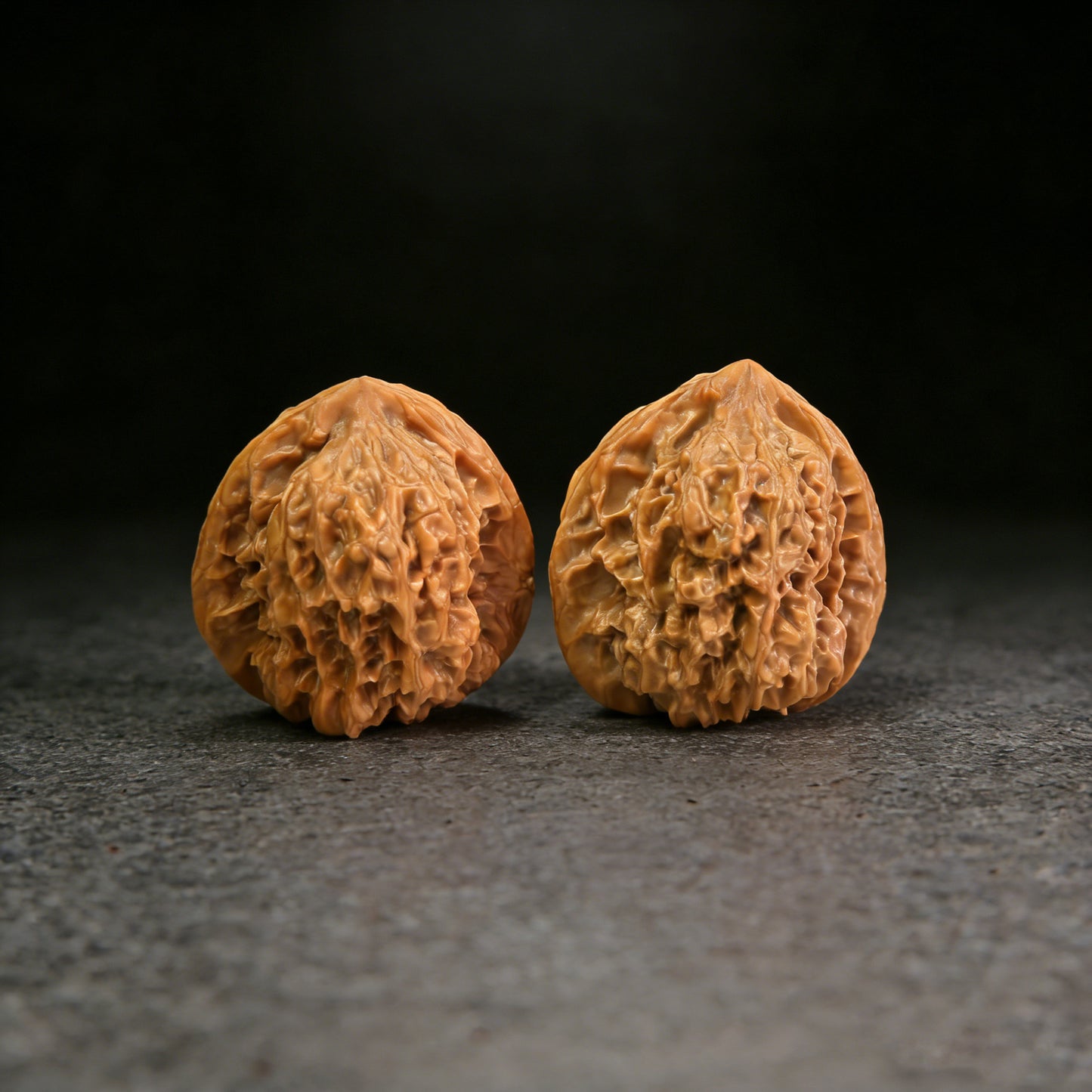 Pair of Walnut Hand Exercisers called Arhat Head, 40mm x 37mm, from ThePatinaProject, with detailed carved design.
