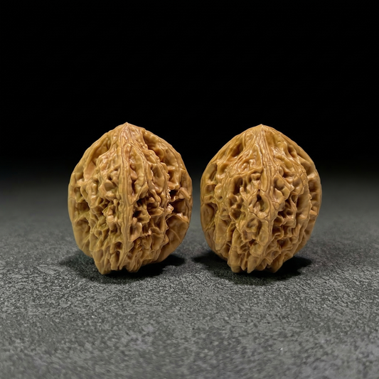 Walnut hand exerciser pair from ThePatinaProject, Beijing Chicken Heart design, 39mm size, JX-406 product image showing textured surface