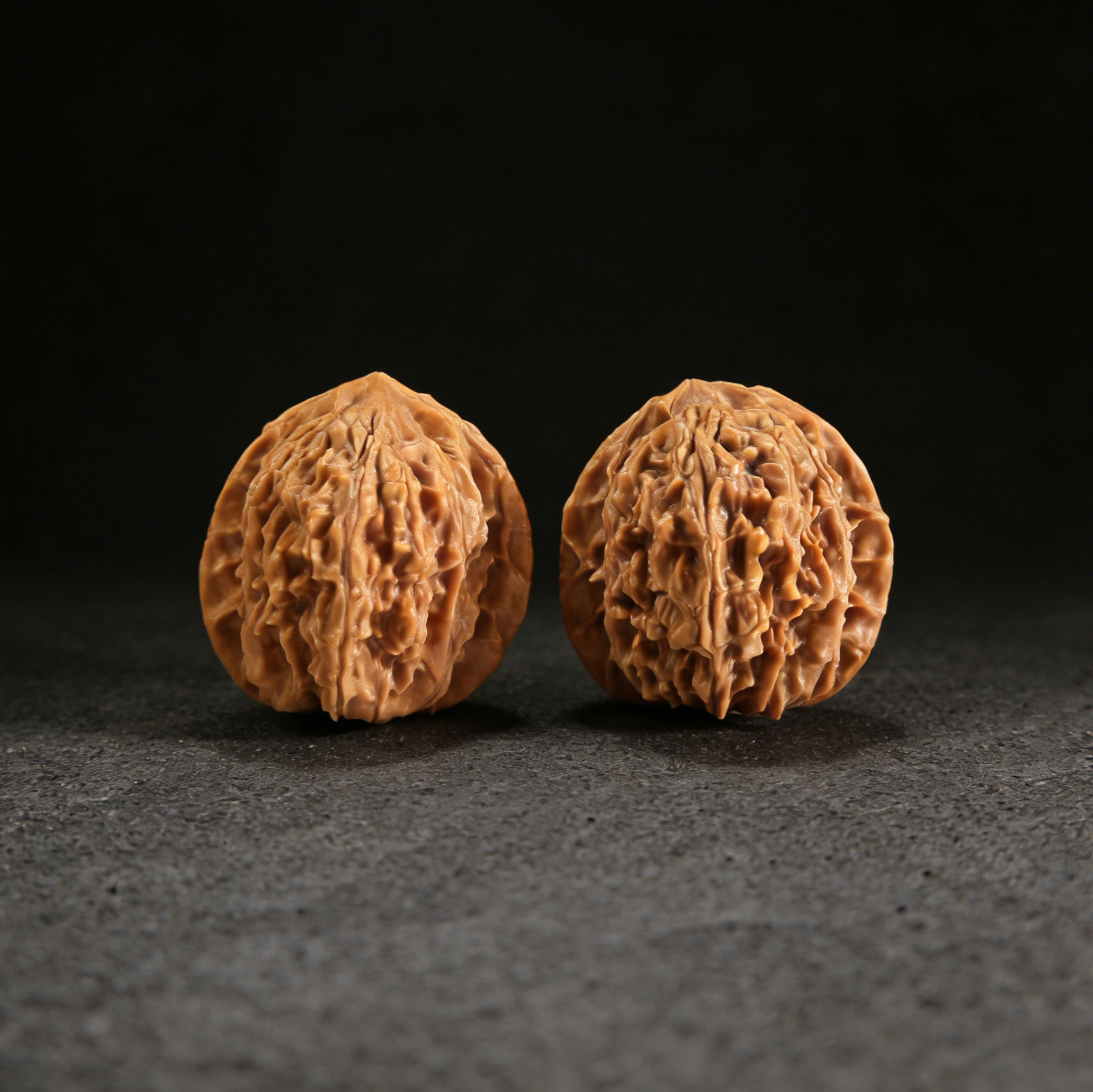Pair of Beijing Chicken Heart Walnut Hand Exercisers by ThePatinaProject, 37mm, featuring detailed carved chicken heart design.