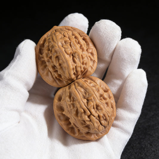 Walnut hand exerciser pair featuring "Big Red Robe" (Da Hong Pao) design, 37mm x 35mm, by ThePatinaProject.
