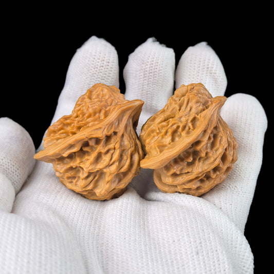 Walnut hand exercisers featuring lion head design, 35mm size, from ThePatinaProject's Birdie Lion Head Pair collection.