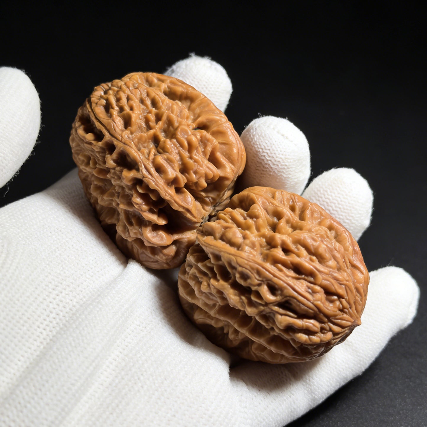 Walnut hand exerciser called "Blizzard" by ThePatinaProject, showing the textured surface and compact size of the BX-302 model.