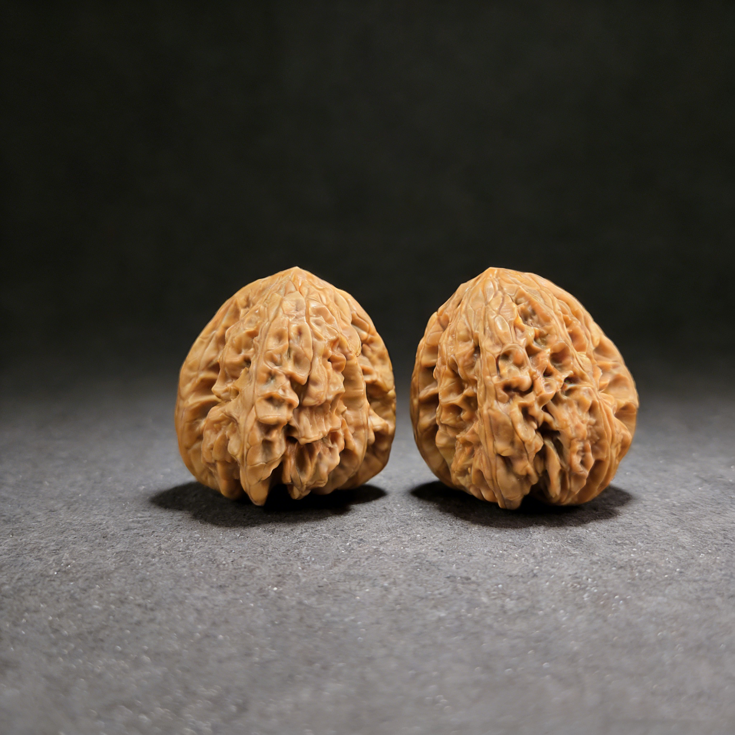 Walnut hand exerciser with lion head design, "Blizzard" Bao Xue pair, 40mm intense texture, ThePatinaProject #BX-01, actual item shown