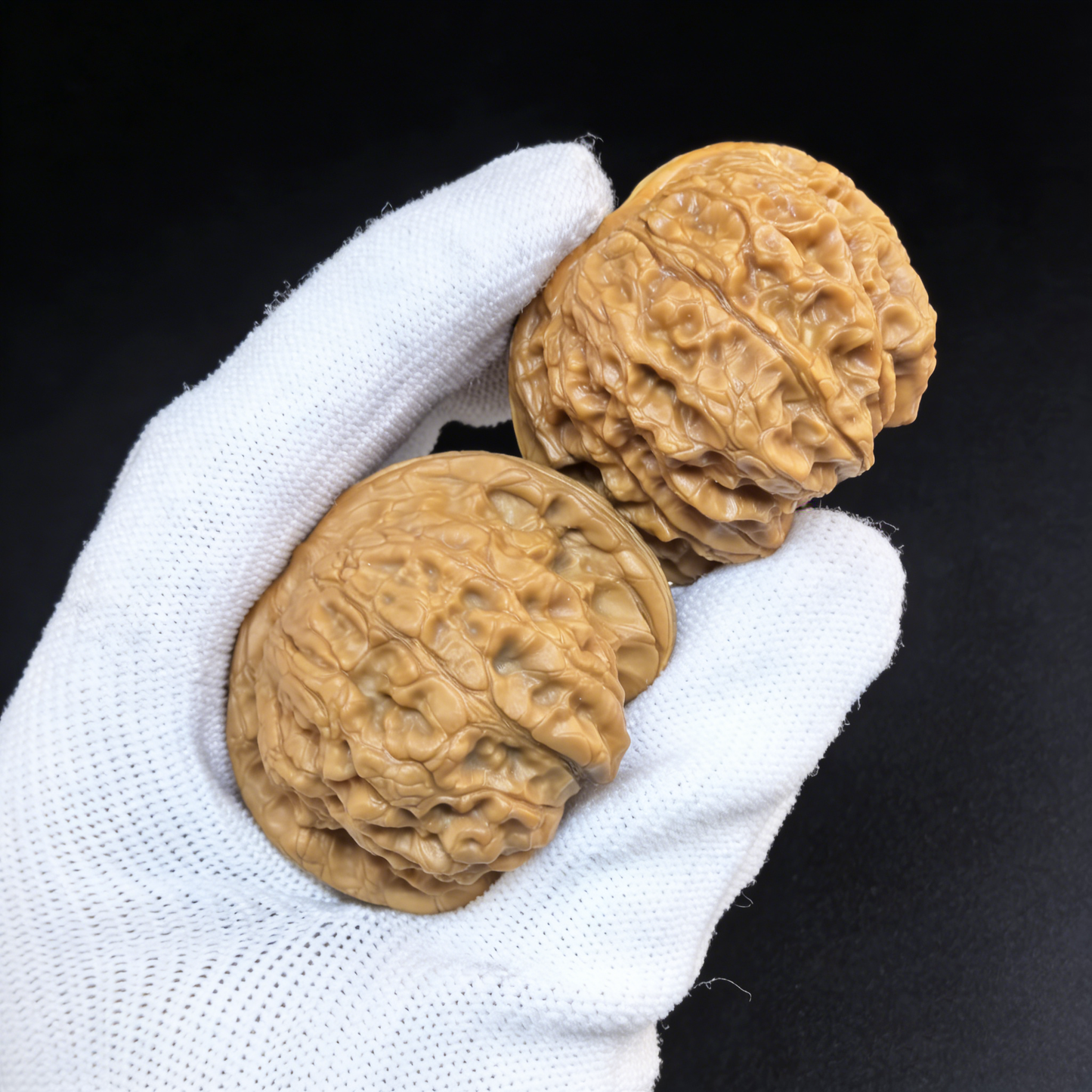 Blood Qilin 43mm giant red patina walnut hand exercisers pair by ThePatinaProject, showing textured red patina finish.