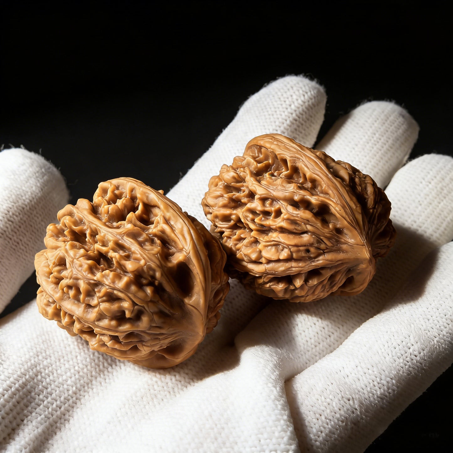 Walnut hand exercisers labeled "Caterpillar" by ThePatinaProject, 34mm diameter, showing textured walnut surface and ergonomic design.
