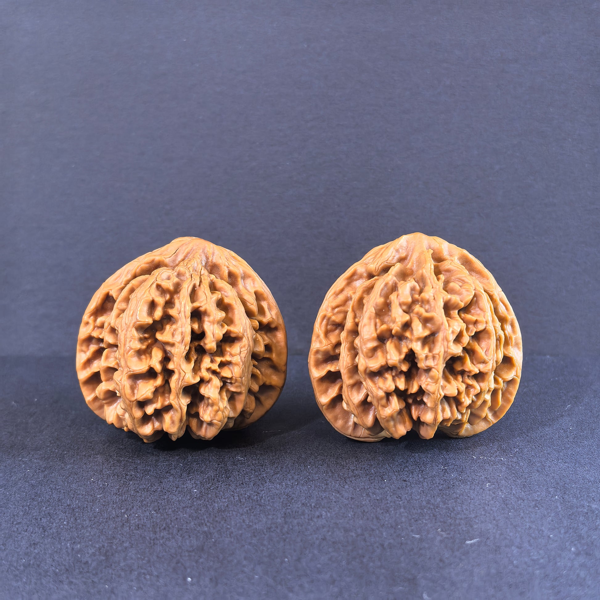 Pair of 43mm Walnut hand exercisers called Champion's Crown by ThePatinaProject, designed for hand strength training.