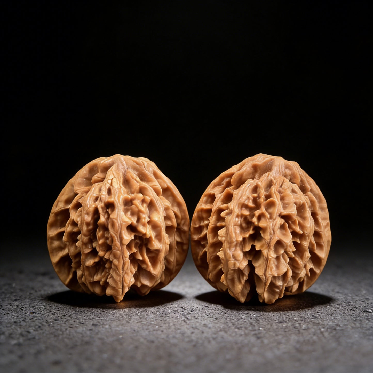 Pair of Champion's Crown walnut hand exercisers from ThePatinaProject, 43mm x 42mm, featuring intricate crown-shaped design.