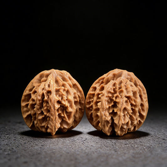 Pair of Champion's Crown walnut hand exercisers from ThePatinaProject, 43mm x 42mm, featuring intricate crown-shaped design.