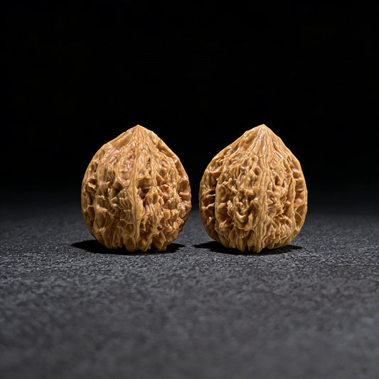 Walnut hand exerciser from ThePatinaProject, Classic Beijing Chicken Heart (Ji Xin) Balanced Pair, 41mm diameter, compact and durable.