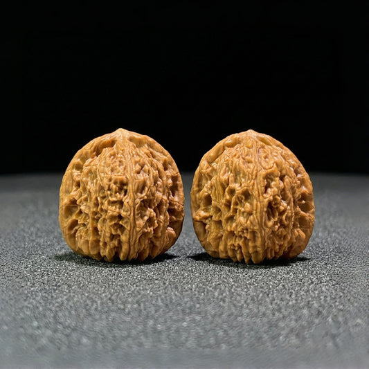 Walnut hand exercisers from ThePatinaProject, balanced 1:1 pair, 38mm x 38mm, designed for grip strength and hand training.