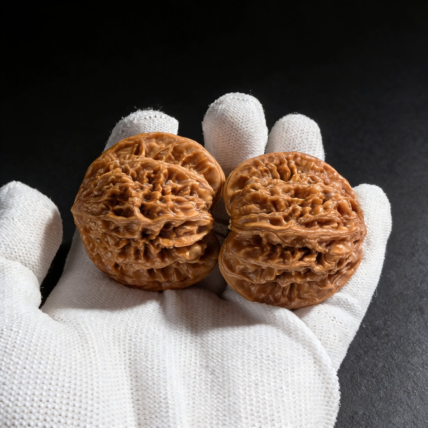 Pair of walnut hand exercisers with coiled dragon design, 43mm by 34mm, from ThePatinaProject's Coiled Dragon collection.