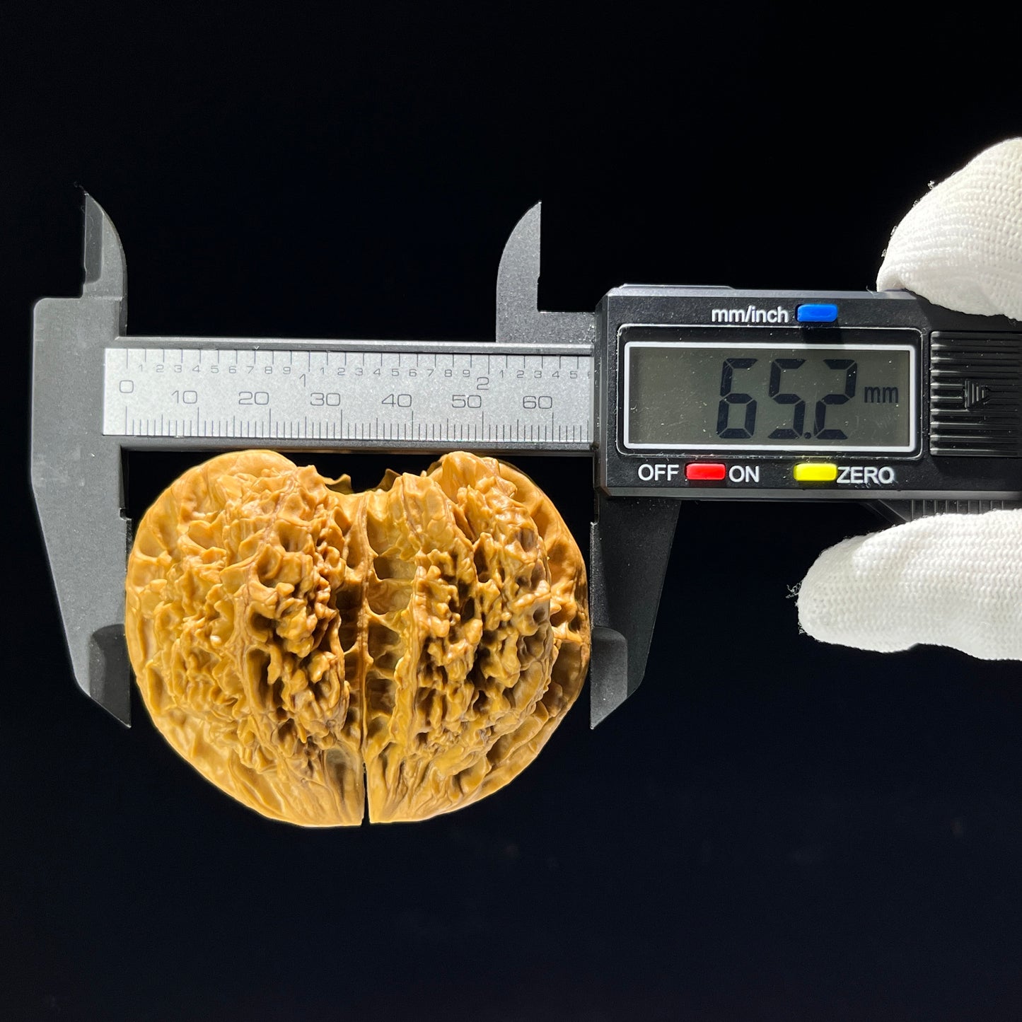 Walnut hand exerciser featuring a conjoined twin horseshoe design from ThePatinaProject, museum-grade, 65mm dimensions.