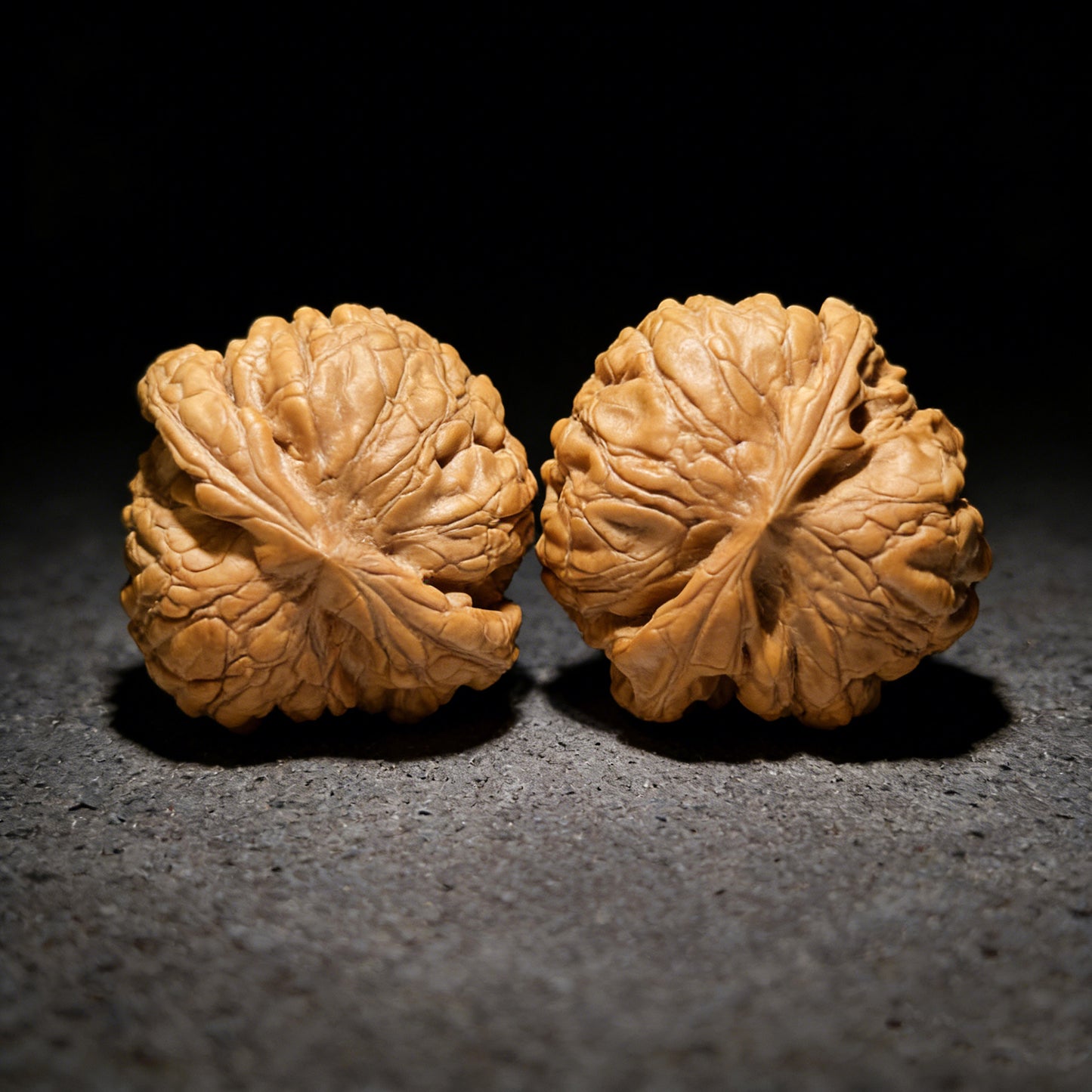 Walnut hand exercisers featuring Dragon Cauldron design by ThePatinaProject, boutique grade, 53mm x 52mm, LD-1001C.