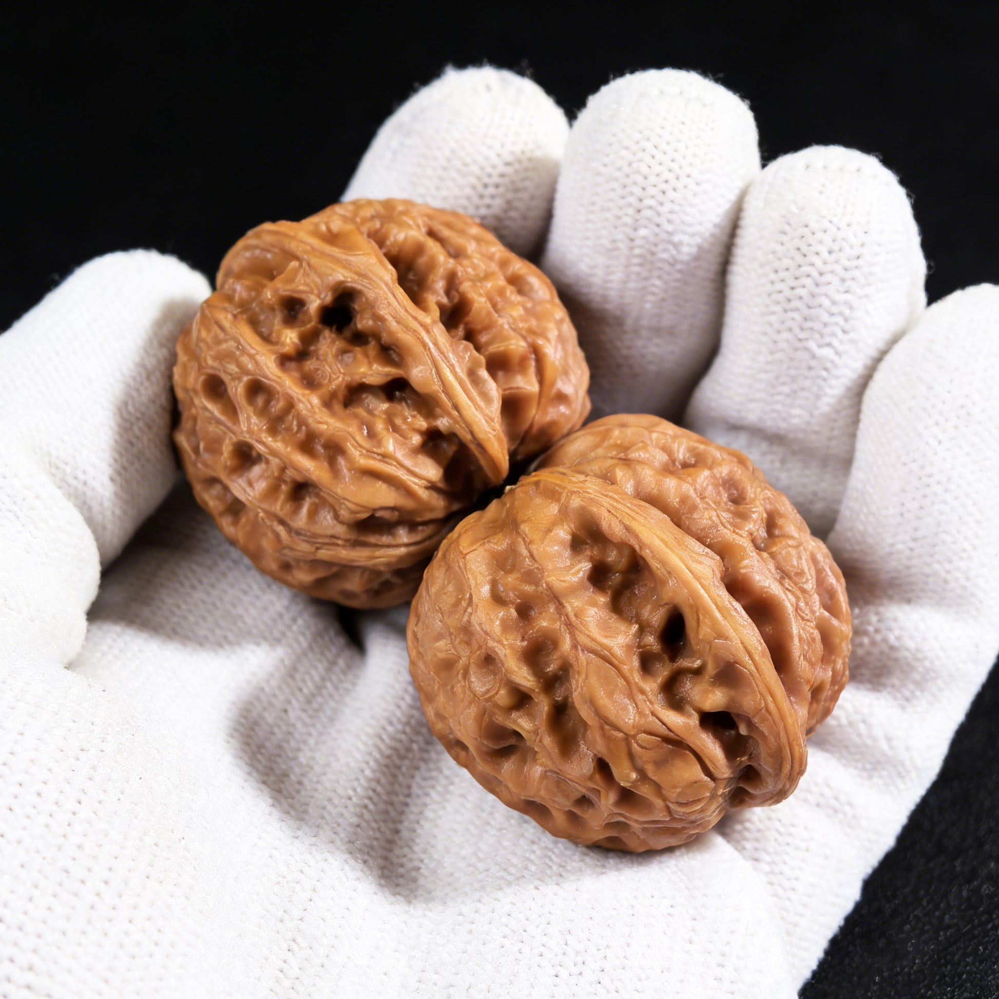Pair of Walnut Hand Exercisers The Dragon Gall (Long Dan) LD-001, 35mm x 34mm, from ThePatinaProject, showing textured wooden grips.