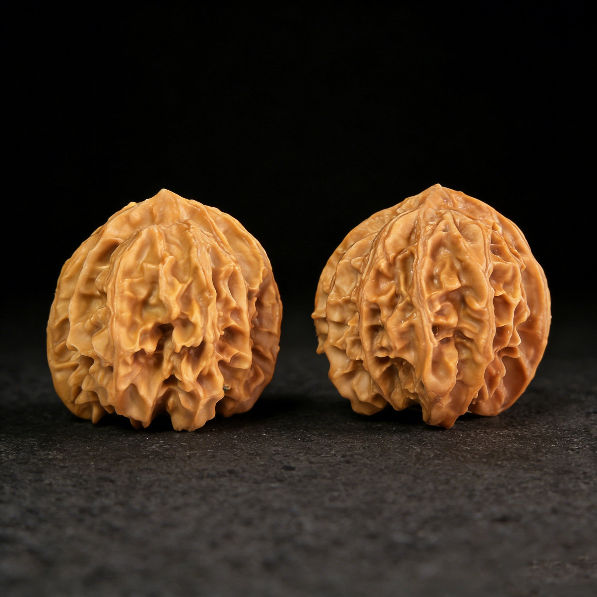 Walnut hand exercisers pair called Dragon Gate Gorge (Long Men Jian), 32mm x 32mm, from ThePatinaProject for grip strength training.