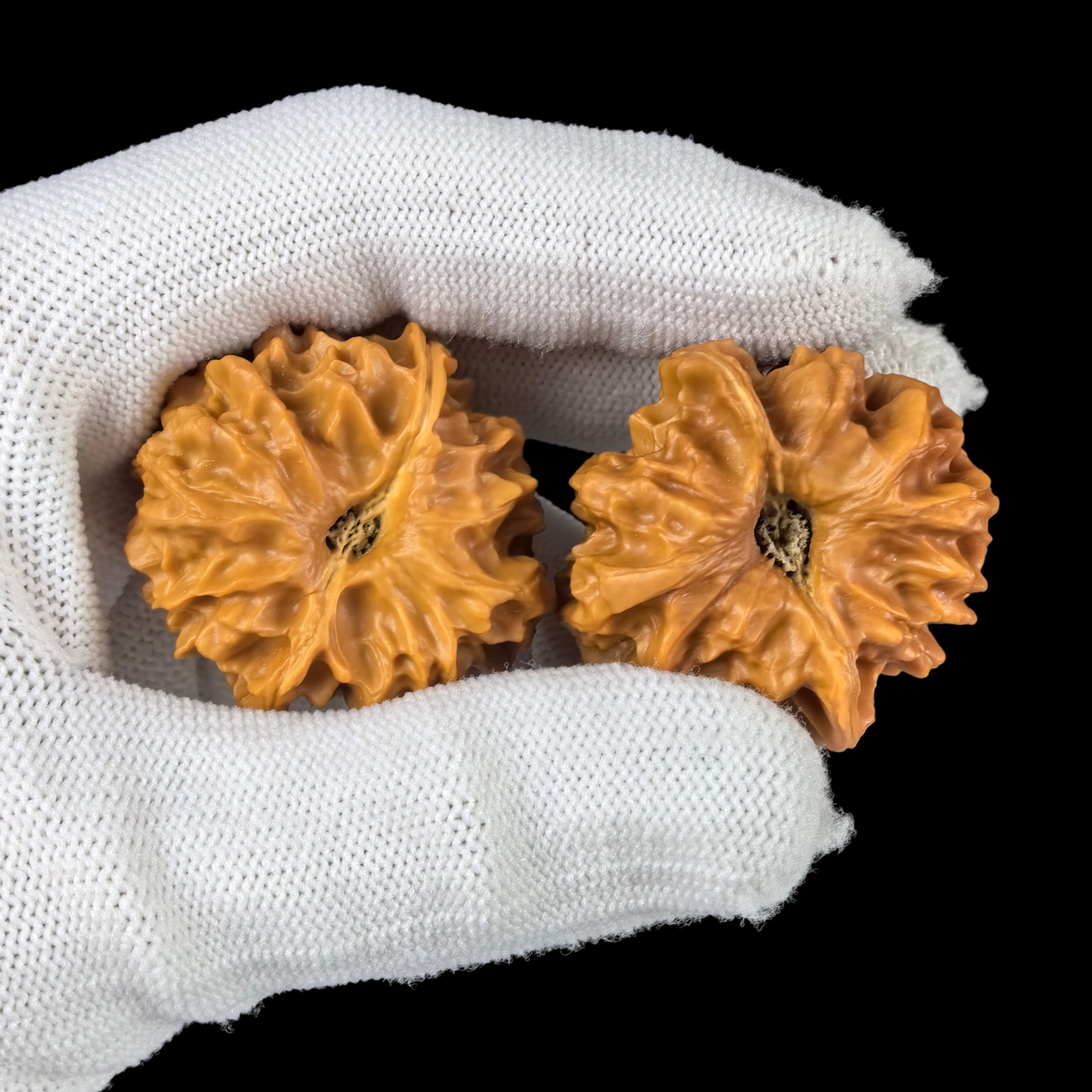 Walnut hand exercisers named Dragon Pearl, XLZ-01, 33mm, from ThePatinaProject, showing textured walnut surface and ergonomic design.