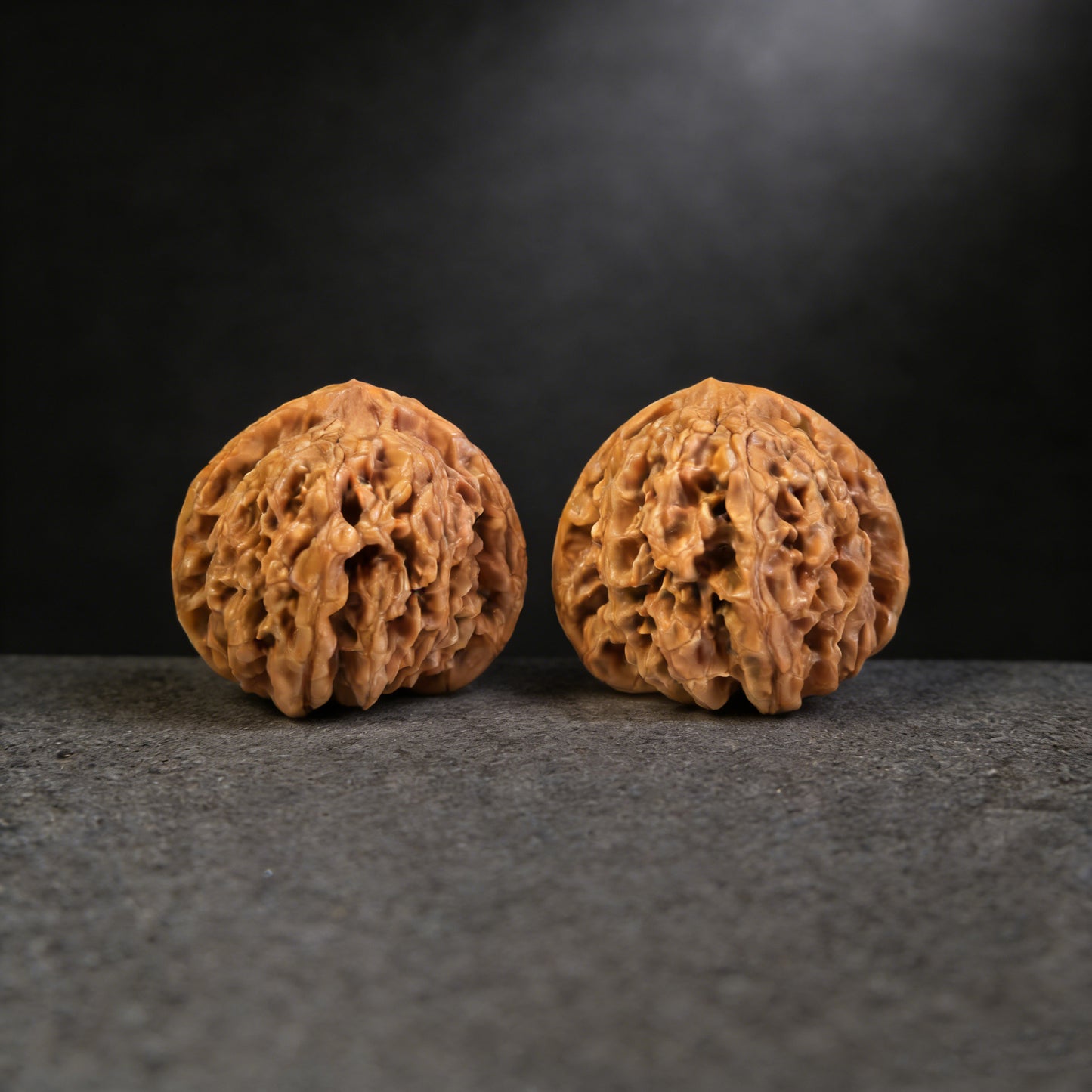 Pair of Chengtuo Dwarf Weight walnut hand exercisers, 39mm x 37mm, from ThePatinaProject, showing the textured wooden surface.