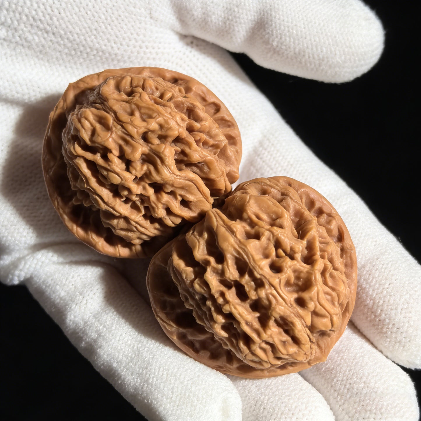 Pair of Chengtuo Dwarf Weight walnut hand exercisers, 39mm x 37mm, from ThePatinaProject, showing textured surfaces and compact size.