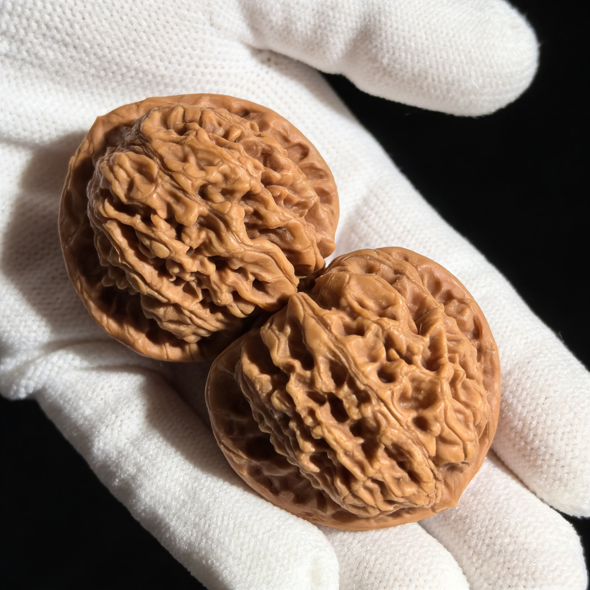 Pair of Chengtuo Dwarf Weight walnut hand exercisers, 39mm x 37mm, from ThePatinaProject, showing textured surfaces and compact size.