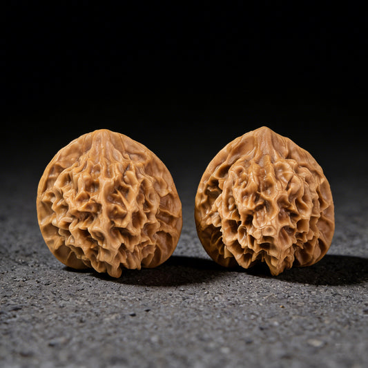 Walnut hand exercisers pair "Emperor" (Di Wang) by ThePatinaProject, 49mm x 45mm, featuring detailed carved designs.
